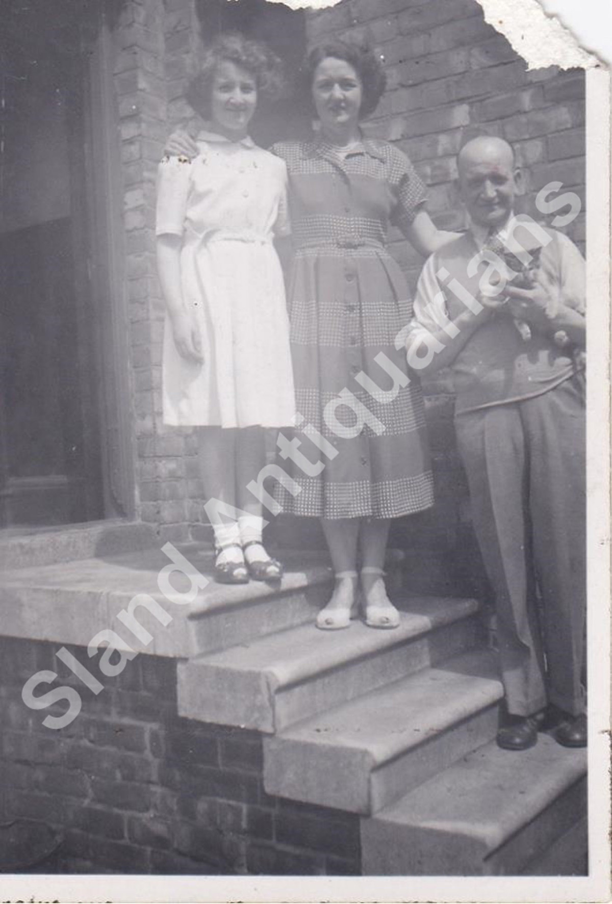 Black Swan.   Family on Back Door Steps